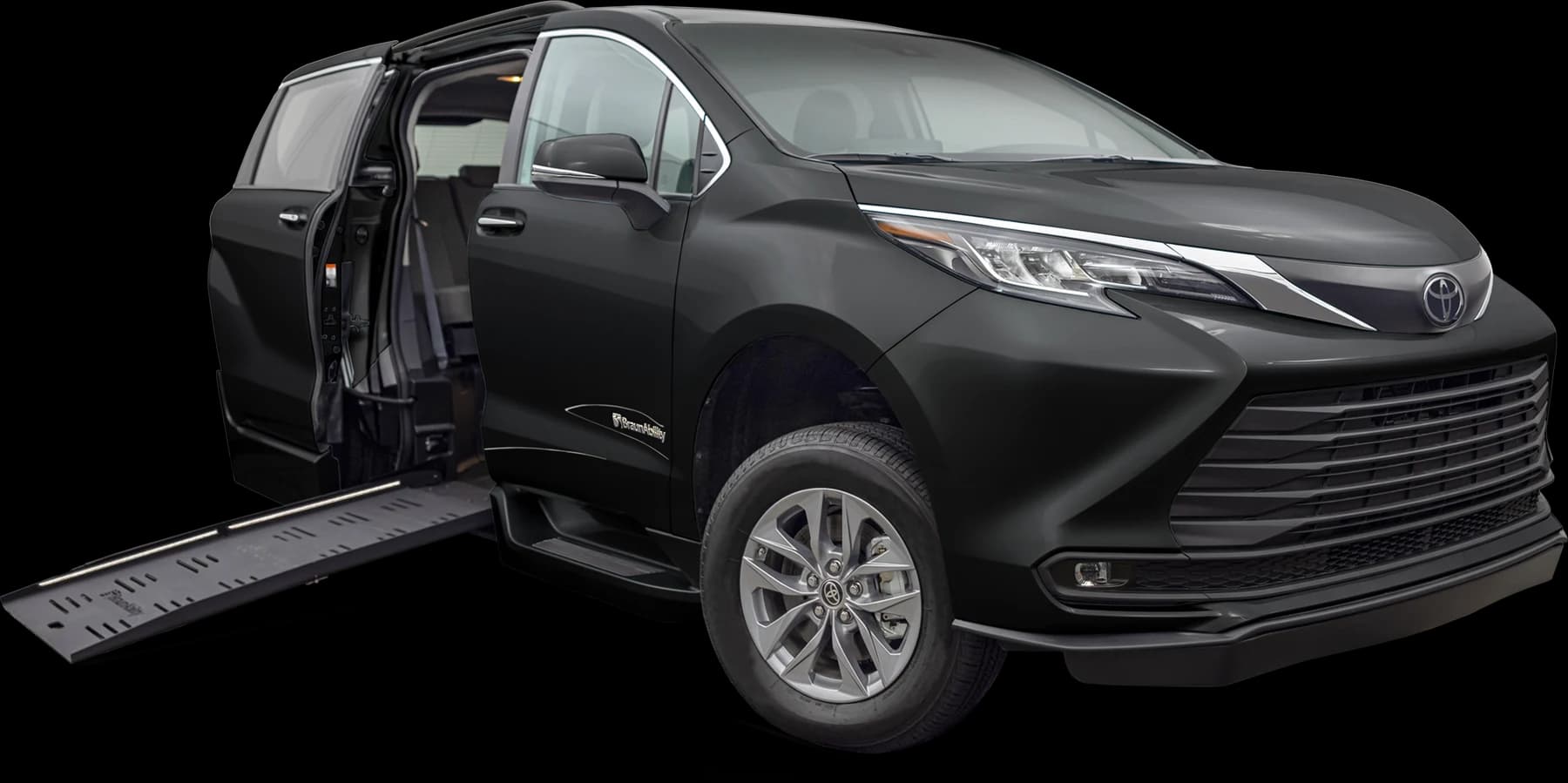 Black Toyota Sienna wheelchair accessible van with the BraunAbility side ramp deployed